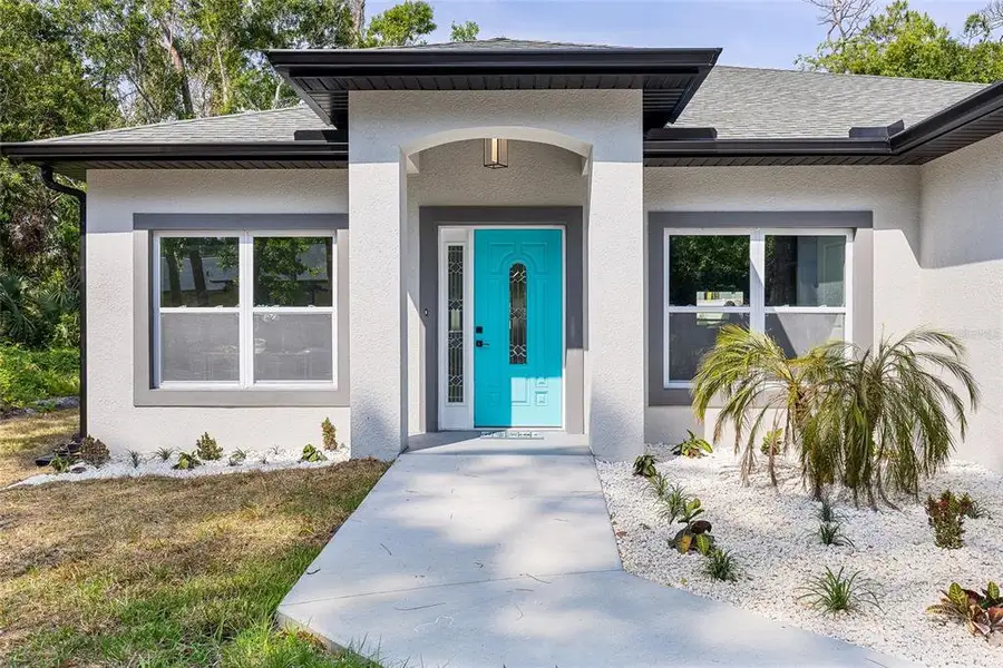 Exterior details and patio area of a home in , Ormond Beach (Image 3).