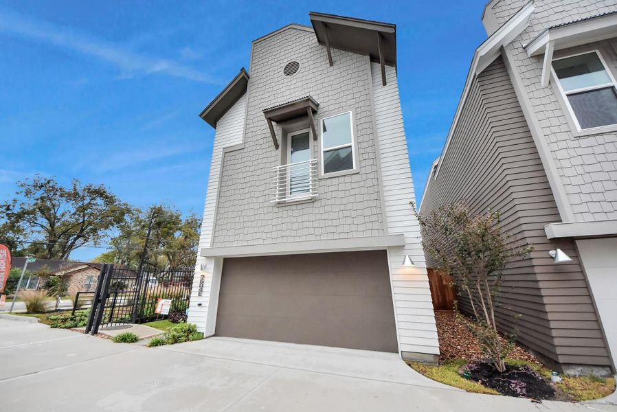 Front exterior of a new home in Carver Landing, Houston, TX, highlighting curb appeal (Image 1).