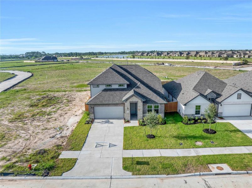 Front exterior of a new home in , Rosharon, TX, highlighting curb appeal (Image 21).