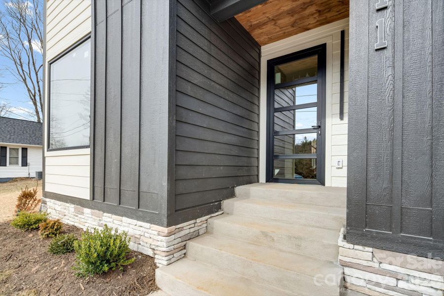 Exterior details and patio area of a home in , Black Mountain (Image 26).