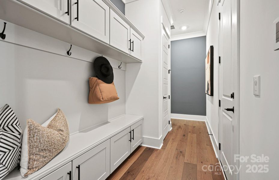 Spacious Mud Room at Garage Entry, Complete with Built in Drop Zone.  Representative Photo.