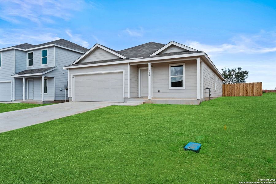 Front exterior of a new home in Lodi Grove, Floresville, TX, highlighting curb appeal (Image 1). Front exterior of a new home in Lodi Grove, Floresville, TX, highlighting curb appeal (Image 1).