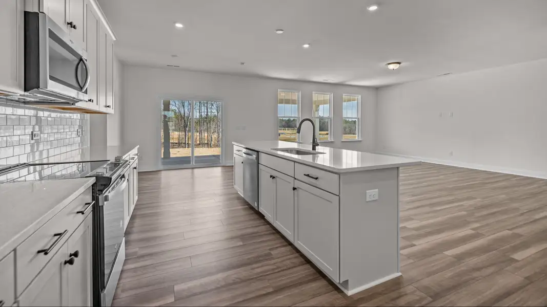 The Norris Plan by DRB Homes in Michaux Gardens - Kitchen & Living Space The Norris Plan by DRB Homes in Michaux Gardens - Kitchen & Living Space