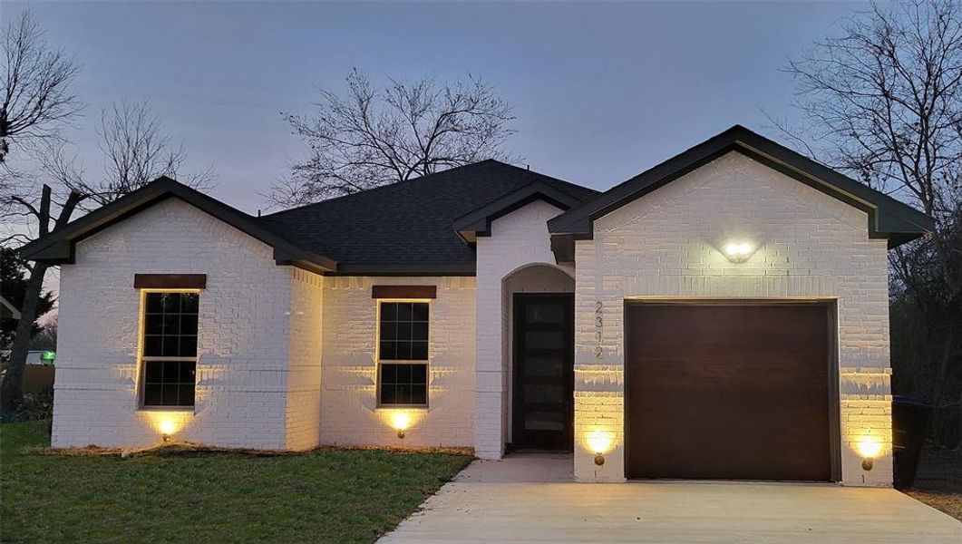 View of front of home with a garage