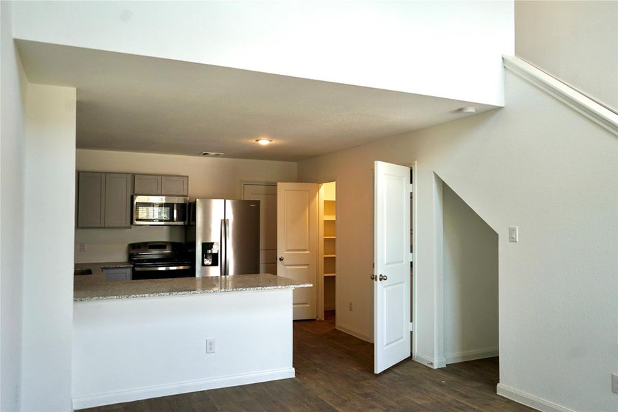 Furnished interior view inside a new home in Marie Village, Conroe (Image 6).