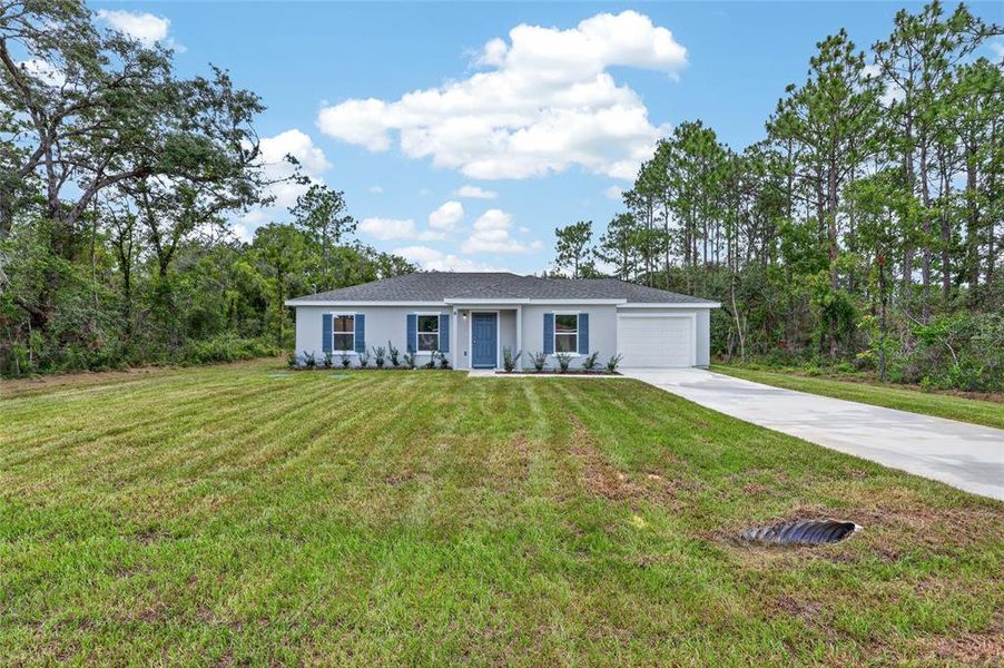 Front exterior of a new home in , Ocala, FL, highlighting curb appeal (Image 18).