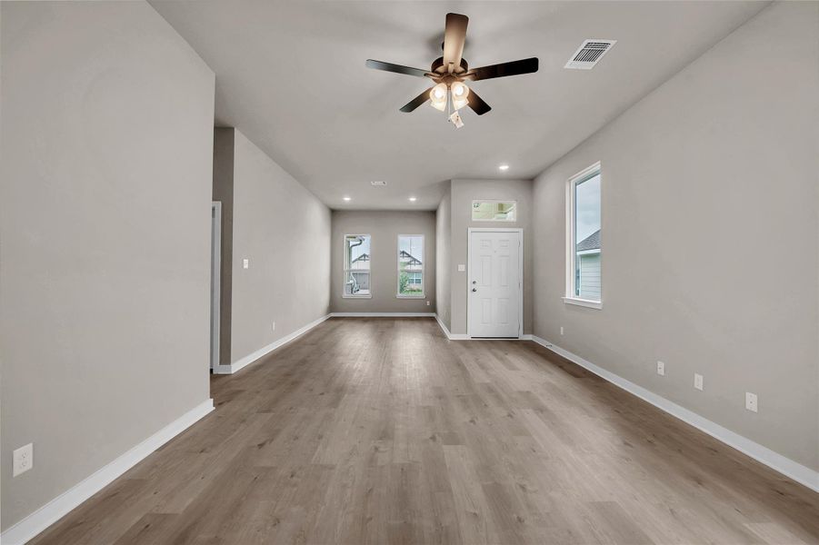 Unfurnished room featuring ceiling fan, recessed lighting, and light wood finished floors