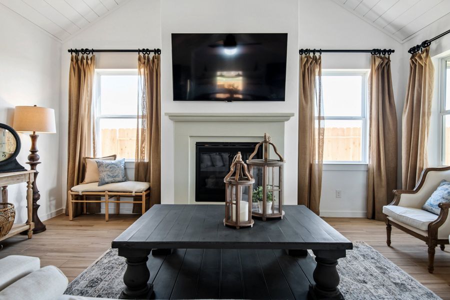Great room with vaulted ceiling and white-painted ceiling beams Great room with vaulted ceiling and white-painted ceiling beams