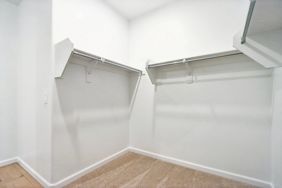 Primary walk in closet Primary walk in closet