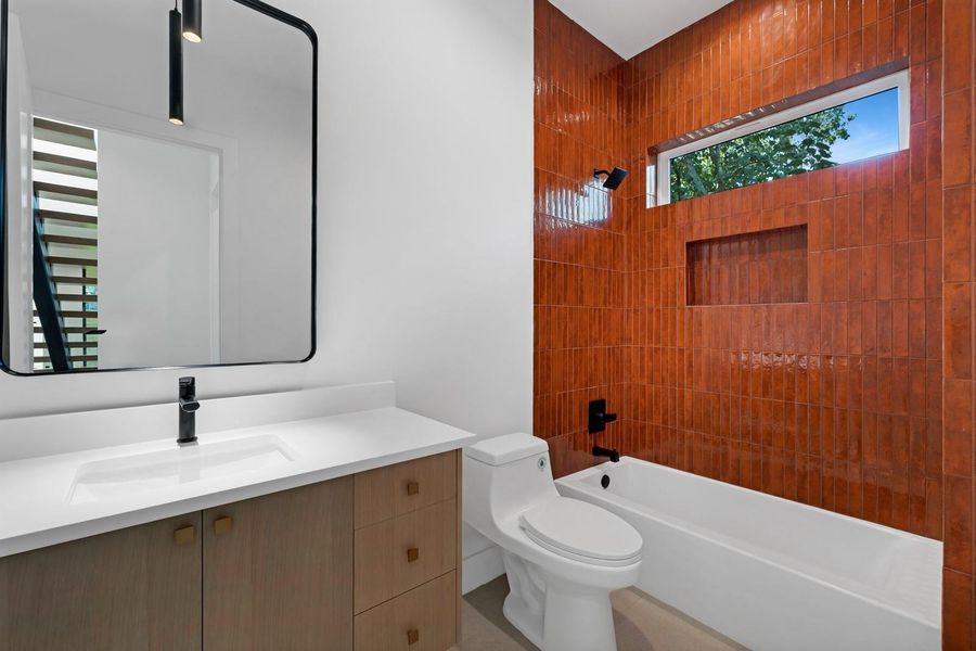 Bathroom with vanity and washtub / shower combination