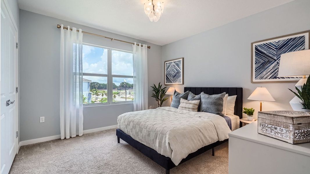 Representative furnished interior of a home built from the Grandcourt by D.R. Horton in Parker Pointe, Homestead (Image 24).
