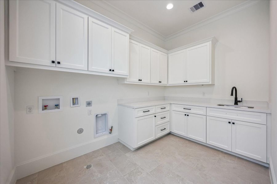 Main laundry room upstairs (An additional stackable laundry closet is downstairs)