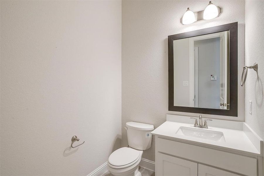 Bathroom with toilet and vanity