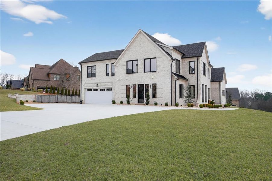 Front exterior of a new home in , Hoschton, GA, highlighting curb appeal (Image 24).