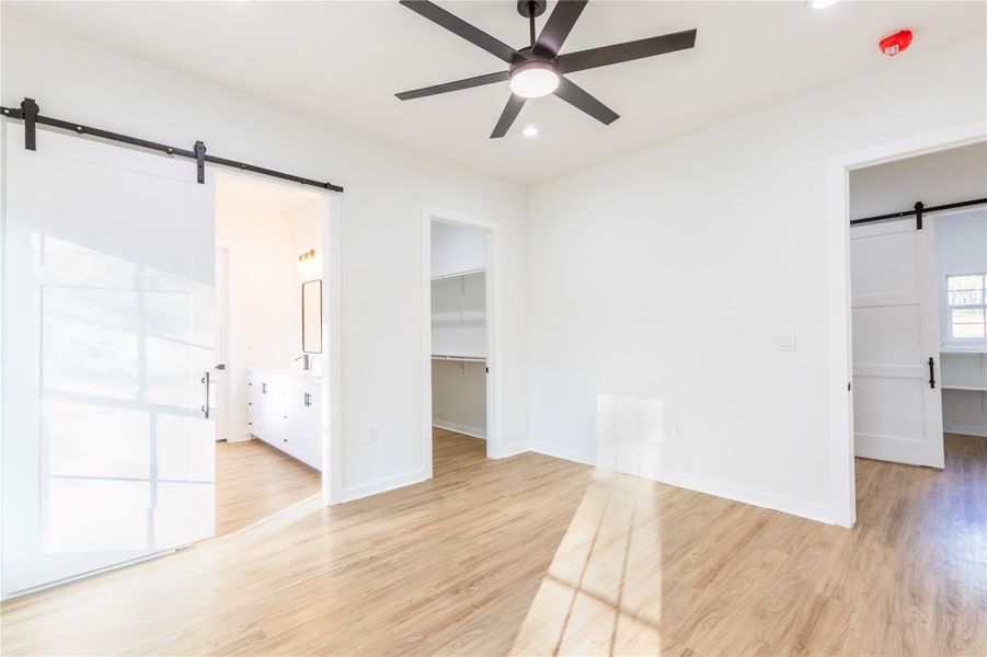 High ceilings create an open, airy feel in the master bedroom.