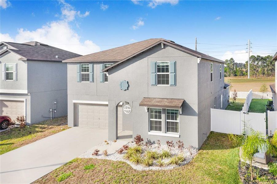 Front exterior of a new home in Wind Meadows South, Bartow, FL, highlighting curb appeal (Image 27).