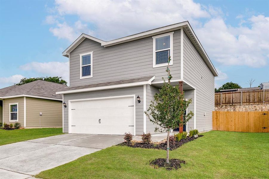 View of front of property with an attached garage and concrete driveway View of front of property with an attached garage and concrete driveway