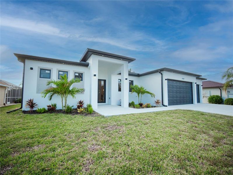 Front exterior of a new home in , Port Charlotte, FL, highlighting curb appeal (Image 18).
