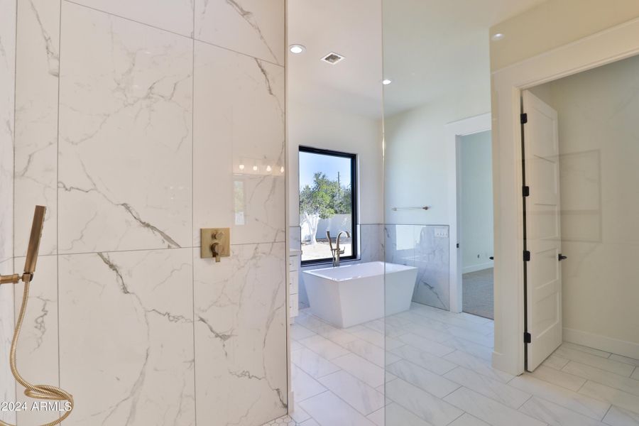 Floor to ceiling tile shower.