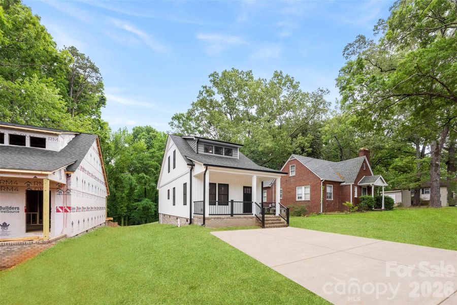 Front exterior of a new home in , Albemarle, NC, highlighting curb appeal (Image 24).