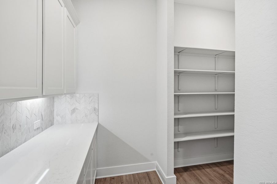 Furnished interior view inside a new home in Potranco Oaks, Castroville (Image 11).