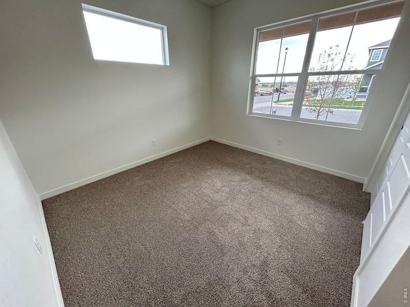 Spacious, unfurnished interior of a new home in Union Colony West, Greeley (Image 13).