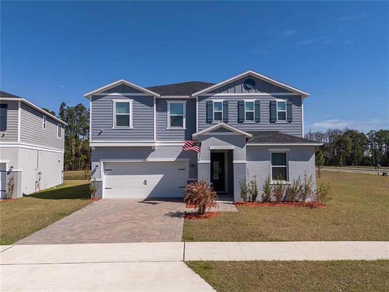 Front exterior of a new home in , Clermont, FL, highlighting curb appeal (Image 34). Front exterior of a new home in , Clermont, FL, highlighting curb appeal (Image 34).