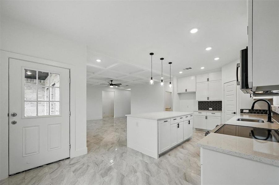 Kitchen featuring recessed lighting, light marble finish flooring, a ceiling fan, white cabinetry, and electric range oven