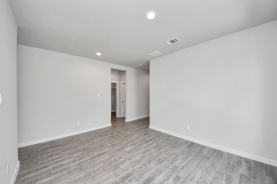 An inviting dining space seamlessly woven into the open concept, connecting the family room and kitchen. Sample photo of completed home with similar floor plan. Actual colors and selections may vary.