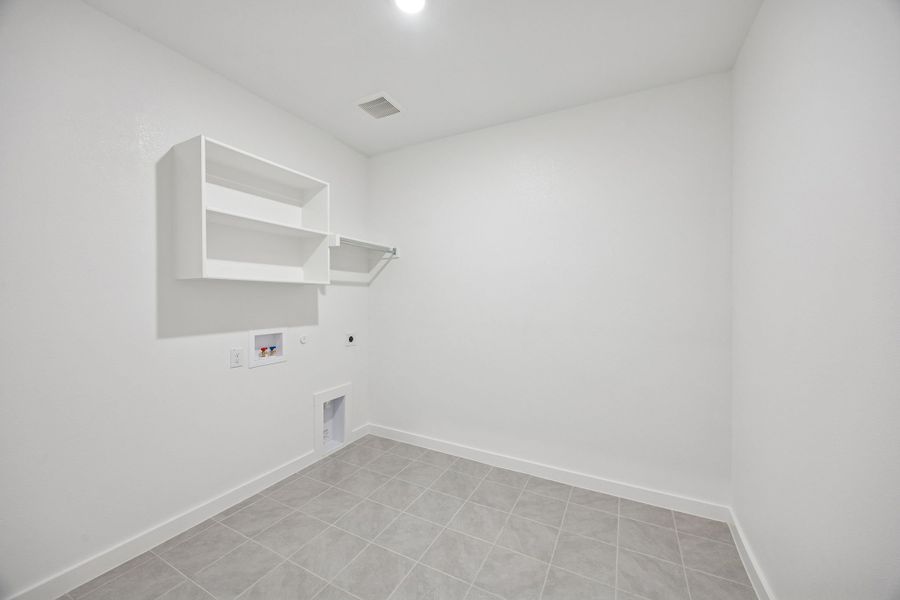 Utility Room in the Wimbledon home plan by Trophy Signature Homes – REPRESENTATIVE PHOTO