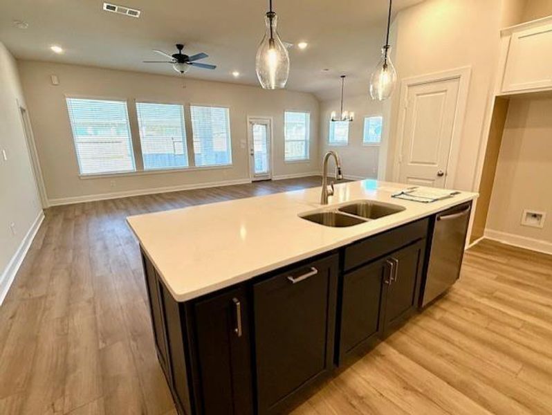 Open design with large breakfast bar & Kitchen open to Family room