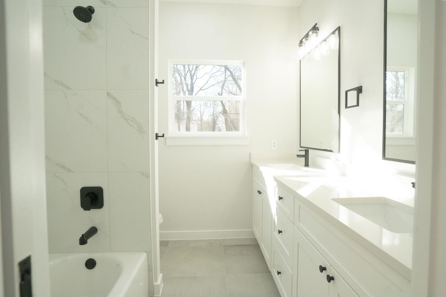Full bath with double vanity and washtub / shower combination