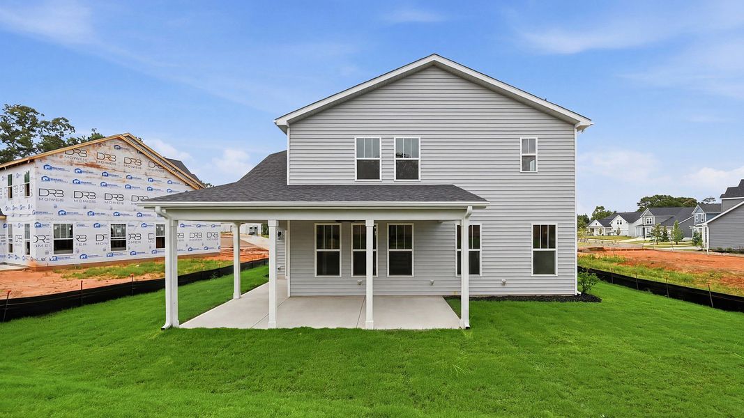 Refined rear exterior with a stylish covered porch for dining, relaxing, or entertaining in Piedmont, SC