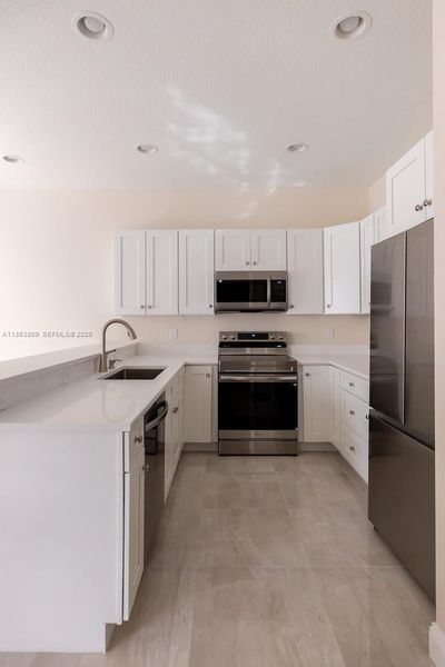 Furnished interior view inside a new home in , Tamarac (Image 11).