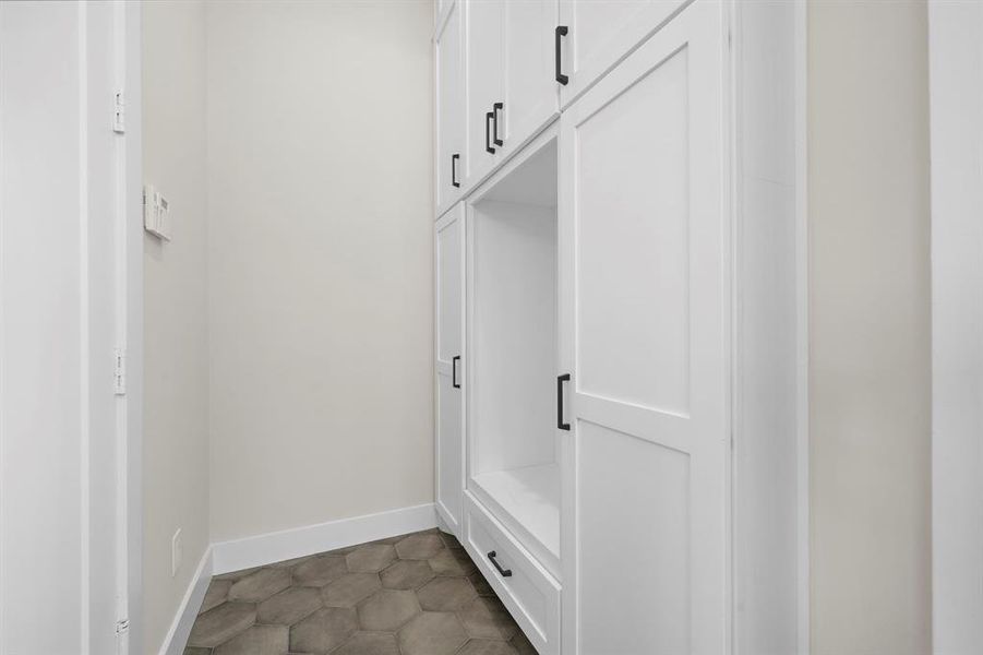 Entering through the garage is a mud room with storage space for bags, pet supplies, and rain boots!