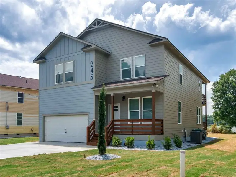 Front exterior of a new home in , Locust Grove, GA, highlighting curb appeal (Image 2). Front exterior of a new home in , Locust Grove, GA, highlighting curb appeal (Image 2).