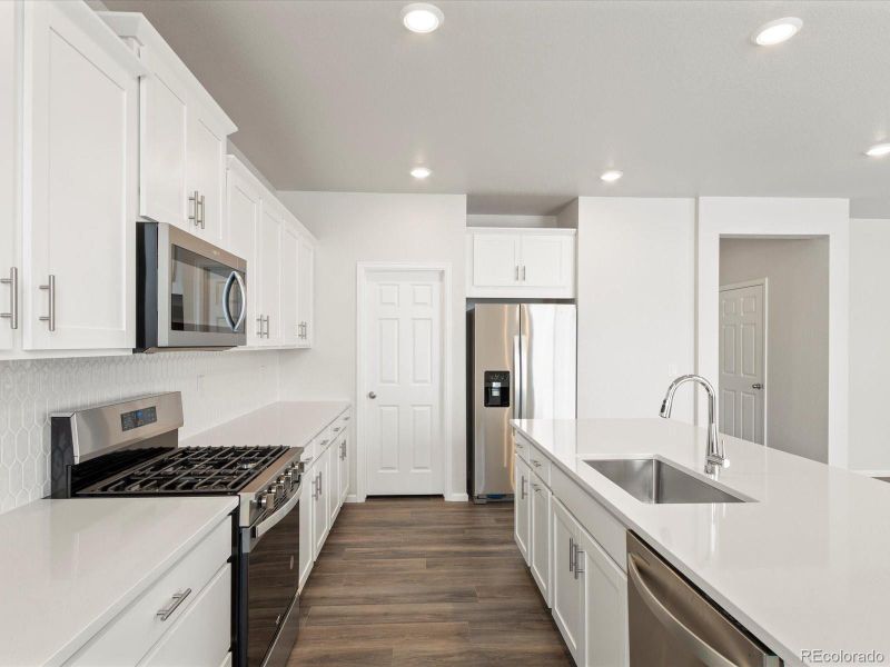 Furnished interior view inside a new home in Poudre Heights: The Alpine Collection, Windsor (Image 12).