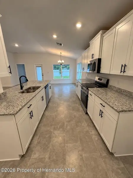Furnished interior view inside a new home in Winding Oaks, Weeki Wachee (Image 3).