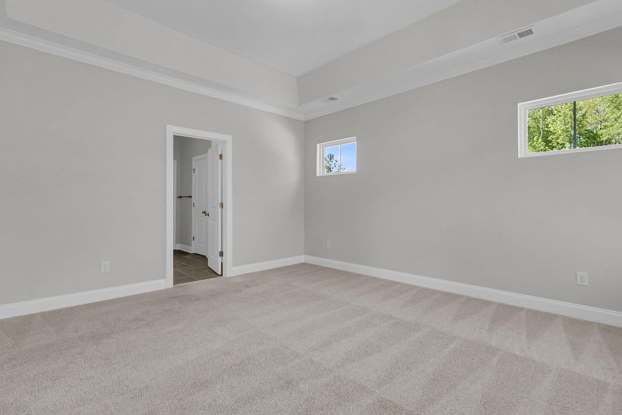 Spacious, unfurnished interior of a new home in Tidewater at Lakes of Cane Bay, Summerville (Image 13). Spacious, unfurnished interior of a new home in Tidewater at Lakes of Cane Bay, Summerville (Image 13).