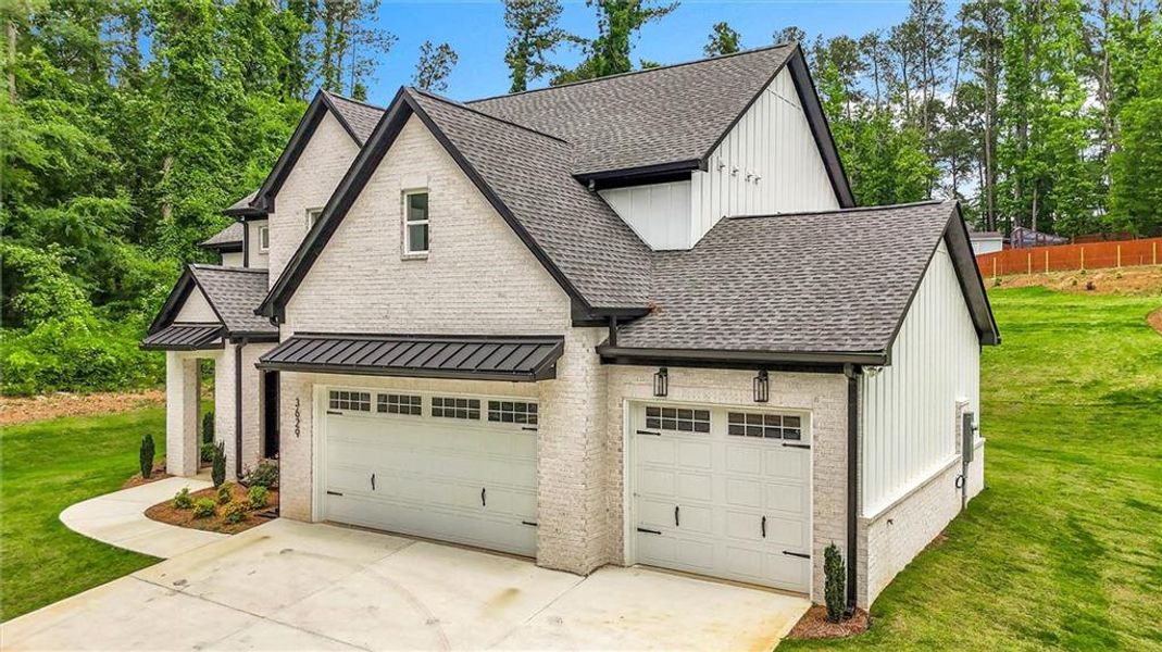 Front exterior of a new home in , Snellville, GA, highlighting curb appeal (Image 27).