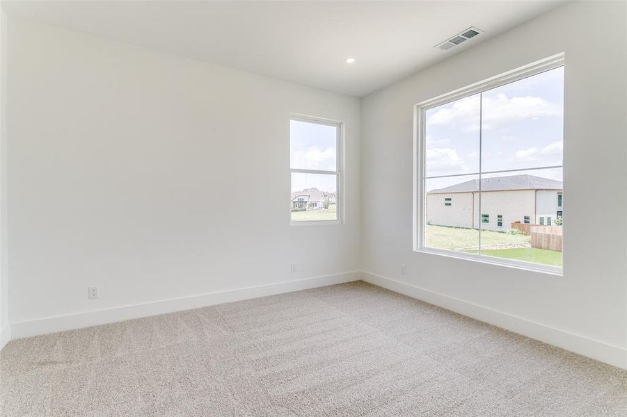 Spare room featuring carpet flooring and recessed lighting Spare room featuring carpet flooring and recessed lighting