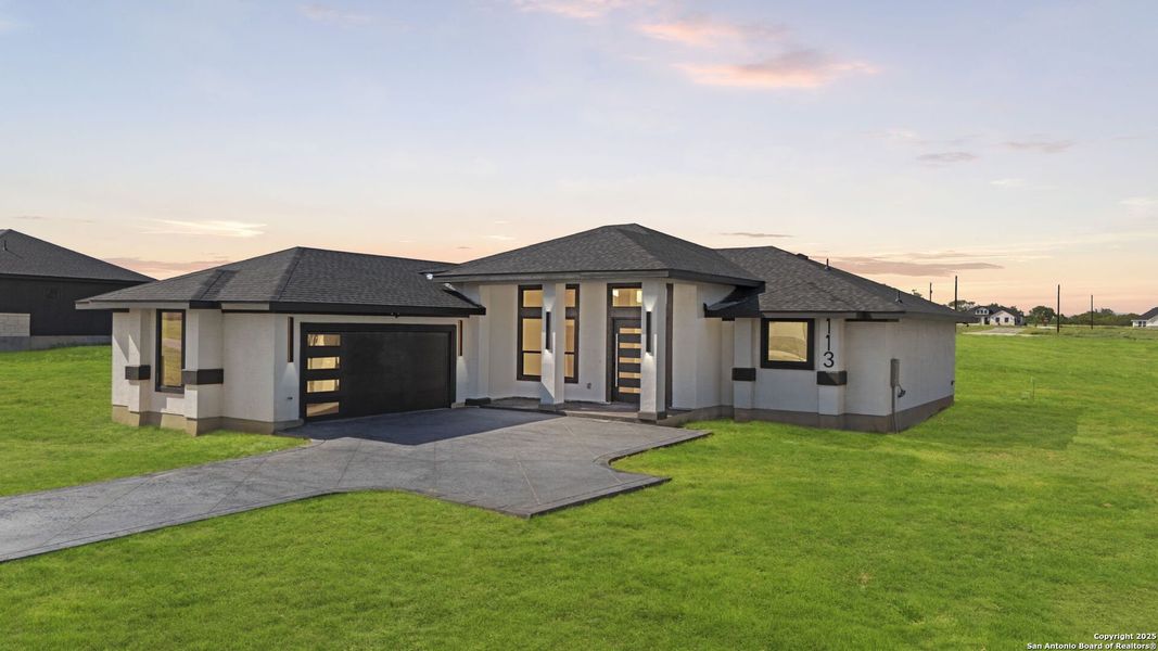 Front exterior of a new home in , Floresville, TX, highlighting curb appeal (Image 2). Front exterior of a new home in , Floresville, TX, highlighting curb appeal (Image 2).
