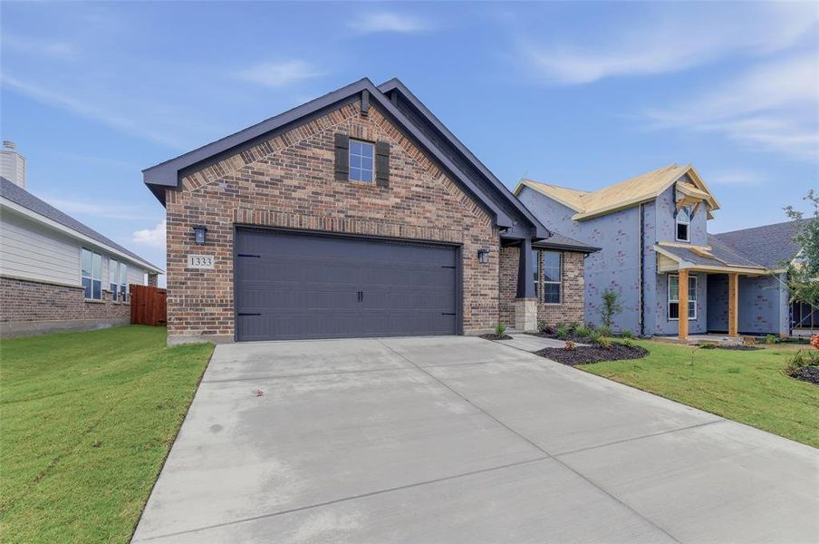 Front exterior of a new home in Covenant Park, Springtown, TX, highlighting curb appeal (Image 2). Front exterior of a new home in Covenant Park, Springtown, TX, highlighting curb appeal (Image 2).