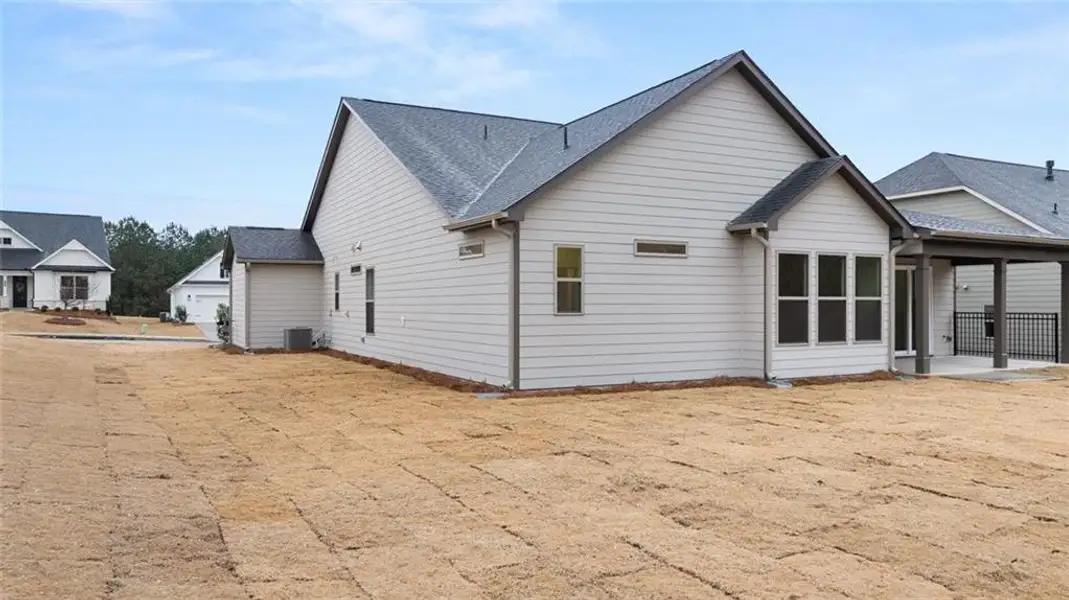 Exterior details and patio area of a home in Soleil Belmont Park, Canton (Image 3).