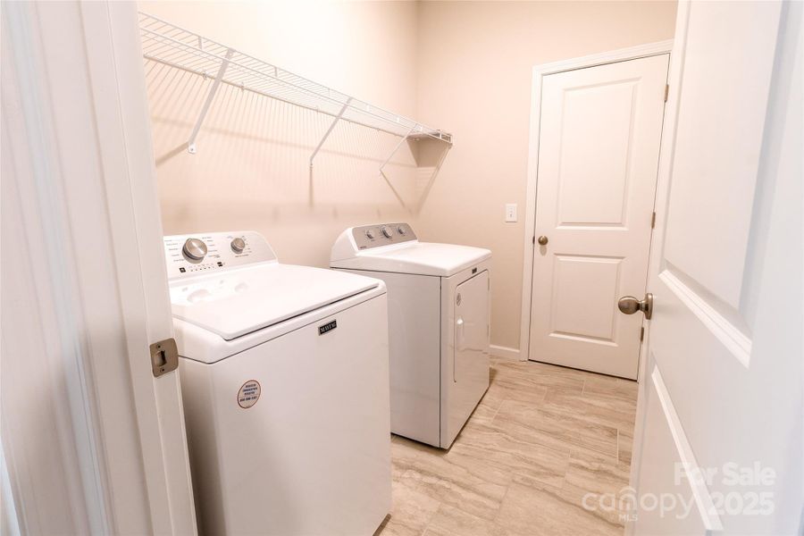 Laundry room off Primary room and hallway