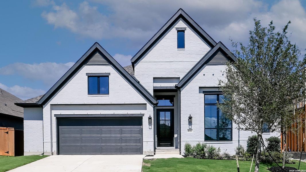 Front exterior of a new home in Veramendi, New Braunfels, TX, highlighting curb appeal (Image 2). Front exterior of a new home in Veramendi, New Braunfels, TX, highlighting curb appeal (Image 2).