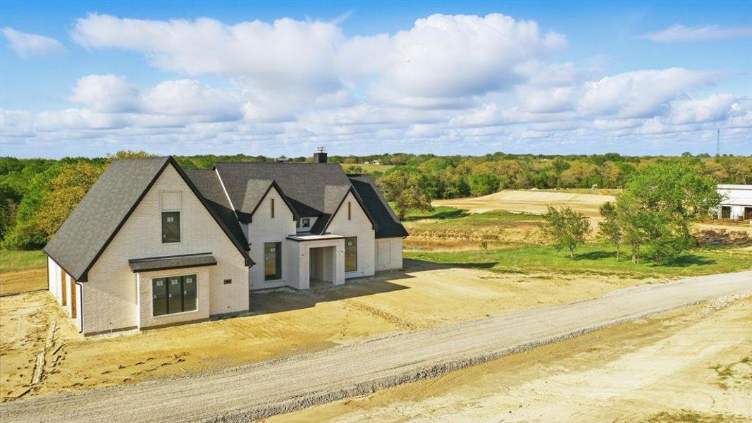 Front exterior of a new home in , Boyd, TX, highlighting curb appeal (Image 24).