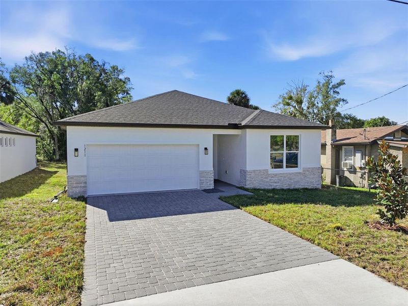 Front exterior of a new home in , Sanford, FL, highlighting curb appeal (Image 1).
