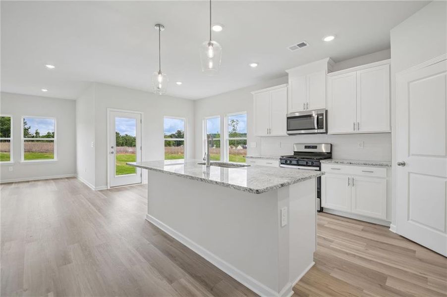 Furnished interior view inside a new home in Northwoods at Mirror Lake, Villa Rica (Image 7).