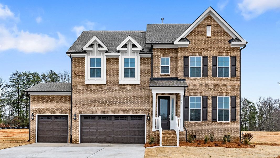 Front exterior of a new home in Lilah Grove, Summerfield, NC, highlighting curb appeal (Image 1). Front exterior of a new home in Lilah Grove, Summerfield, NC, highlighting curb appeal (Image 1).